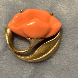 Vintage 70s Avon stamped peach colored flower with gold brushed gold.